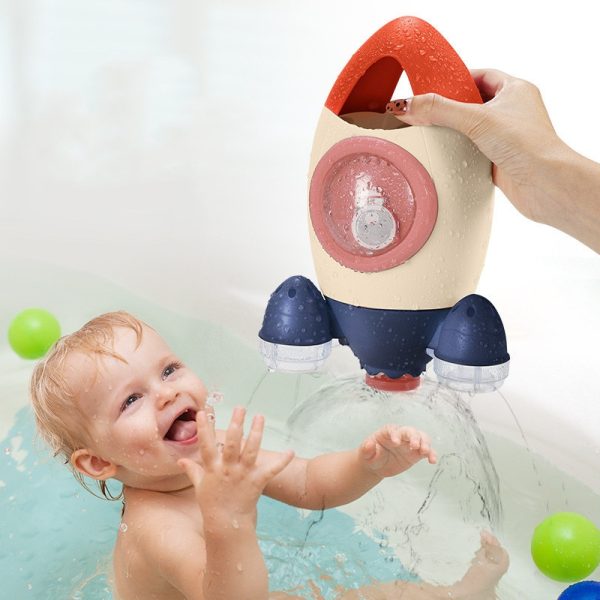 Toy rotating water-spraying rocket bath toy